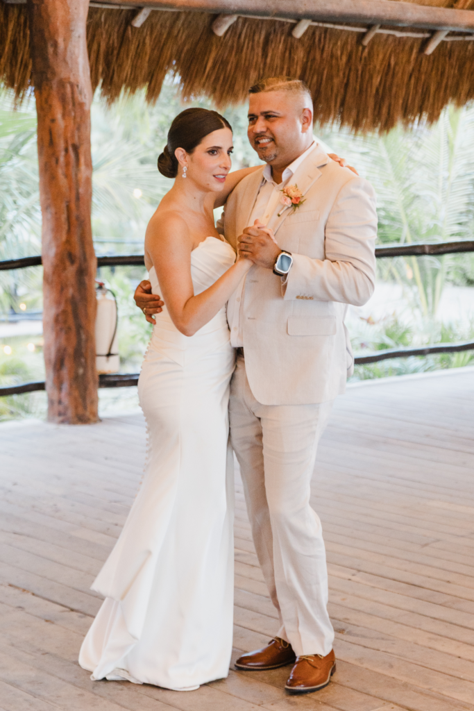 Sleek low bridal updo at Blue Venado Weddings by Sarah Garnier Hair & Makeup Artists in Riviera Maya, Mexico