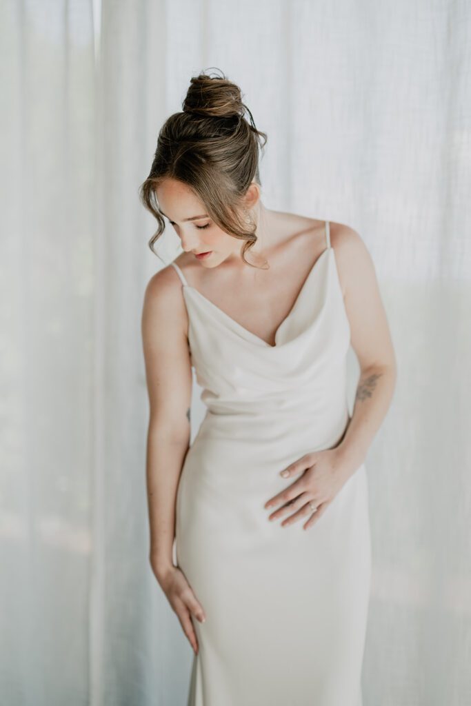 High bridal bun for minimalist slip wedding dresses. Tip by Sarah Garnier Hair & Makeup Artists in Riviera Maya, Mexico